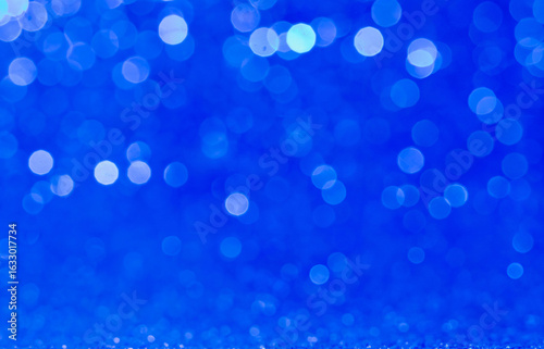 Blue glitter bokeh lights abstract background