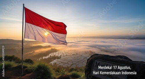 National flag waving over sunrise landscape