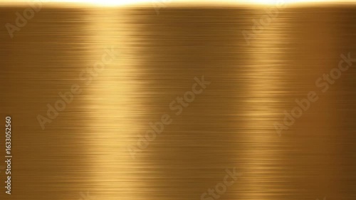 Close-up of a brushed, golden metal surface with subtle horizontal lines and light reflections.