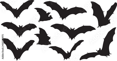 Collection of black bat silhouettes flying against a white background animal creature
