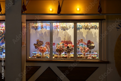 Bouquets of lollipops in a shop window at an amusement park