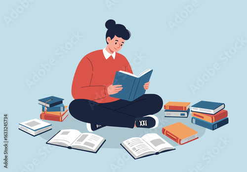 A young student sits cross-legged on the floor, deeply absorbed in reading a book, surrounded by stacks of literature for education.