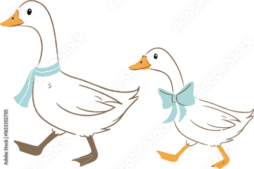 A domestic white goose and a duck with her ducklings walk on the green grass near the water
