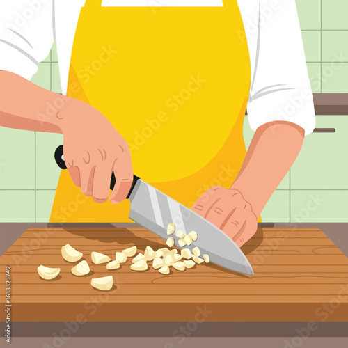Person Chopping Garlic on Cutting Board with Knife in Kitchen