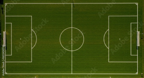 Overhead perspective of a soccer field showcases clean lines and green spaces perfect for background