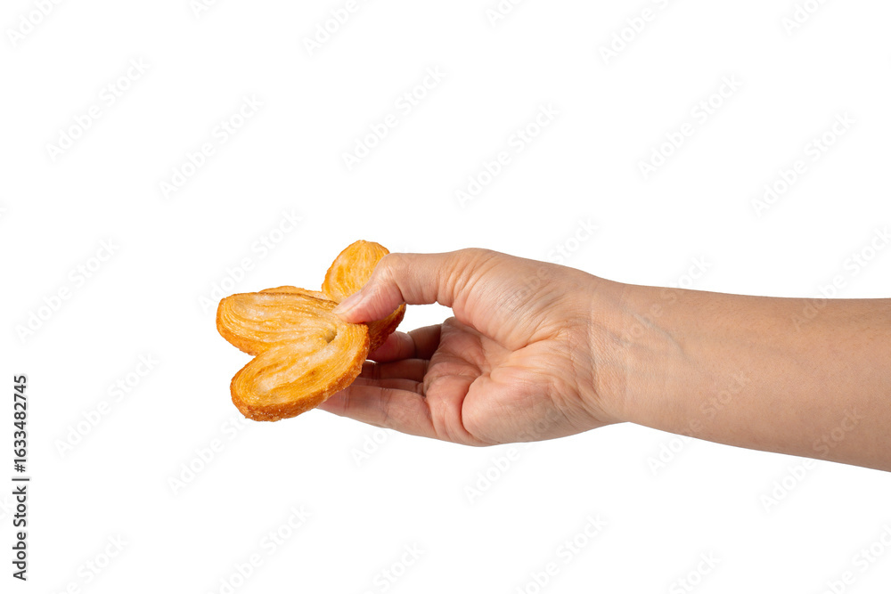 Heart shaped sugared crackers in hand on transparent background Heart shaped sugared crackers in hand on transparent background