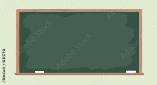Green chalkboard with wood frame & two chalk pieces on a pale background