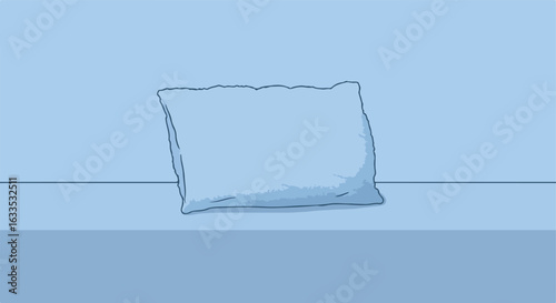Soft, slightly skewed pillow resting on a flat surface in shades of blue