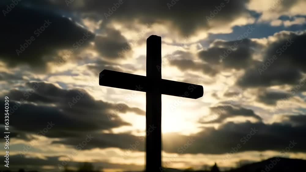 Sunset silhouette of cross against dramatic sky Sunset silhouette of cross against dramatic sky