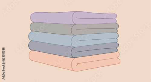 Stack of folded towels in pastel colors against a light peach background