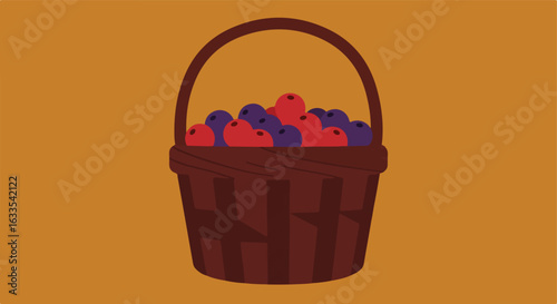 Wicker basket filled with red and purple berries on brown background