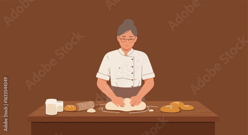 Baker kneads dough on a wooden table