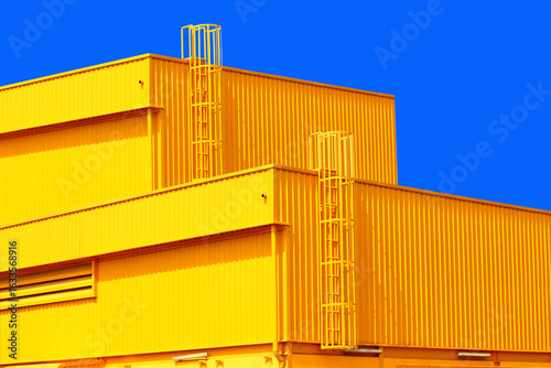 architecture design square shape corrugated wall geometric buiding. The factory warehouse is exterior decorated with corrugated texture to create a point of interest with beautyl