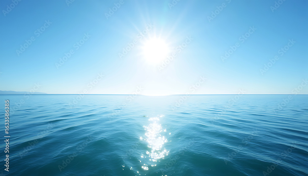Obraz premium Bright sun shining over calm blue ocean water with reflection
