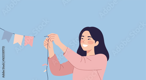 Woman hangs pastel bunting string