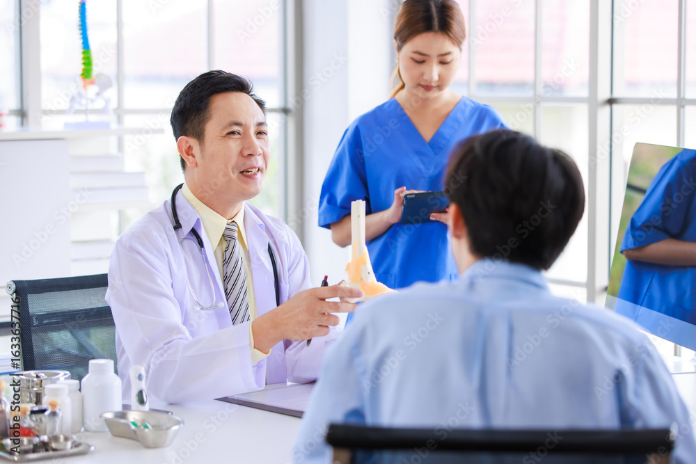 Obraz premium Asian male doctor consulting explain medications to senior female patient assisted by caregiver and nurse professional support trust healthcare checkup, insurance treatment wellness in hospital clinic