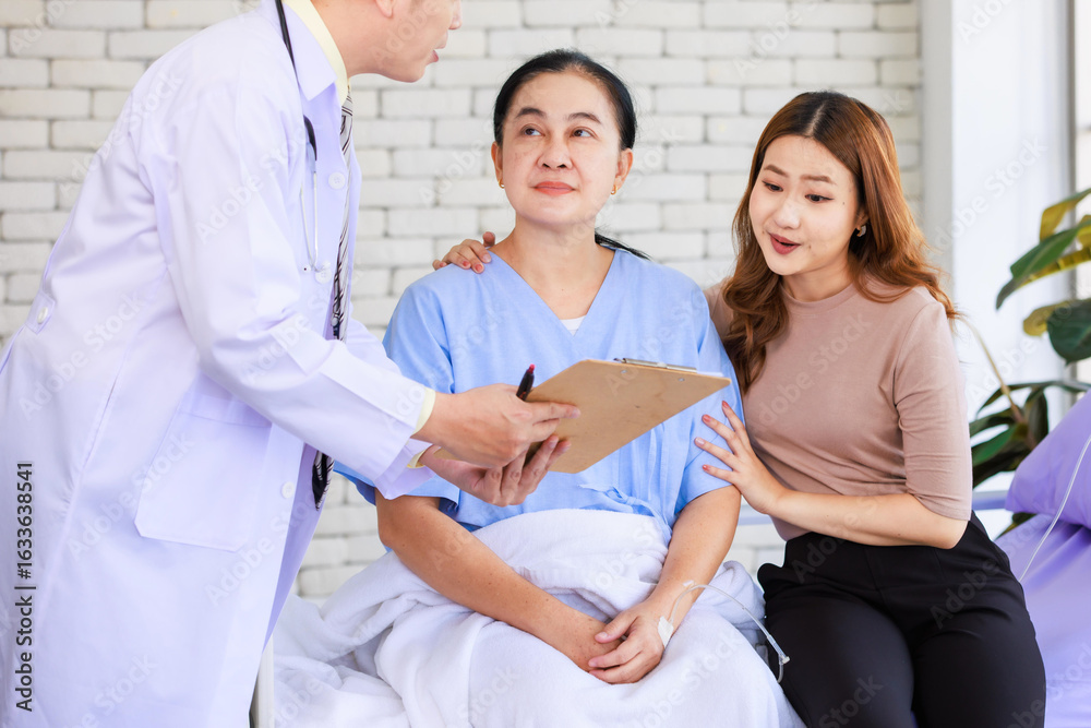 Fototapeta premium Asian man professional doctor visiting ward talking giving report good news to smiling and happy family and senior woman patient sitting on hospital bed with lovely daughter showing healthcare support