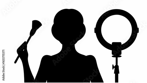 Silhouette of woman holding makeup brush with ring light on stand for beauty and tutorial content