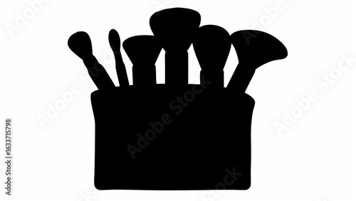 Silhouette illustration of a collection of makeup brushes standing upright in a container on a white background