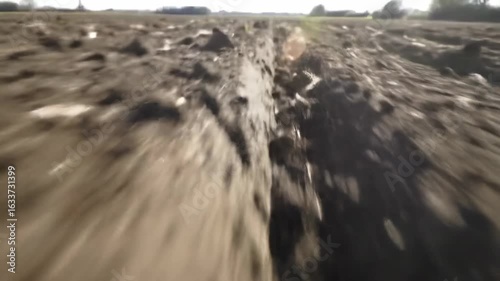 Plowed field path natural light and agricultural landscape