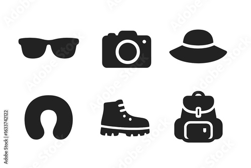 Travel essentials icons set. Solid black vector symbols of sunglasses, camera, sun hat, travel neck pillow, hiking boots, backpack. Simple filled travel accessory pictograms for tourism and vacation