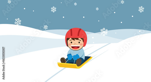 Cheerful Boy Enjoying Winter Sledding Activity In Snow With Safety Helmet