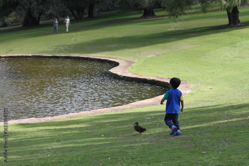 young boy playing in the park