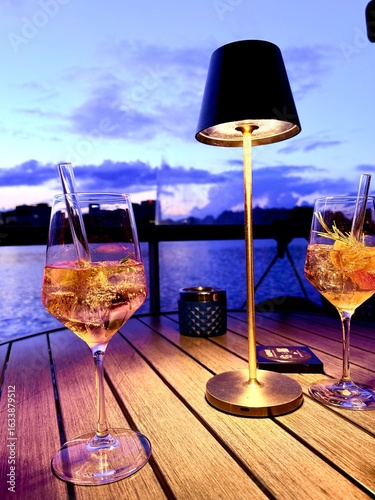 aperol glass at the lake restaurant, sunset time
