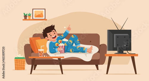Happy Boy Enjoys Movie Night On Couch At Home Relaxing In Pajamas