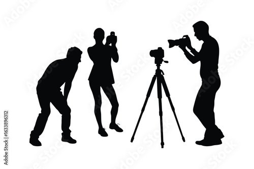Silhouettes of people taking photos with cameras and a tripod