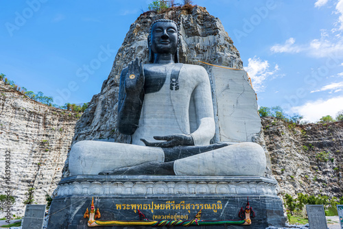 Big Lord Buddha Stone Mountain is landmark of Wat Khao Tham Thiam in province Suphanburi, Thailand. A place everyone in every religion can visit.