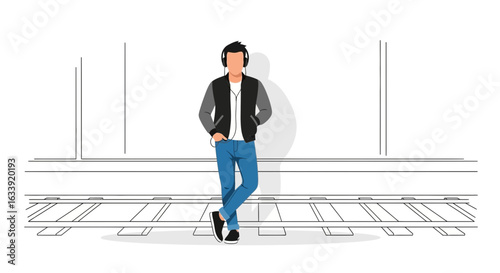 Trendy Young Man With Headphones Standing At Subway Platform Waiting Train