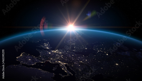  Sunrise over planet Earth. Planet Earth from the space. Europe at night viewed from space with city lights in Germany, France, Spain, Italy, Portugal, United Kingdom, Turkey.