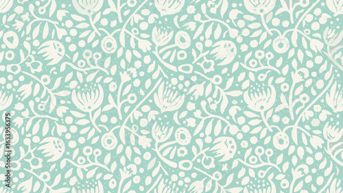 Floral pattern with leaves and berries on a light blue background creating a seamless design