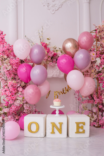 Pink decor with flowers for first birthday