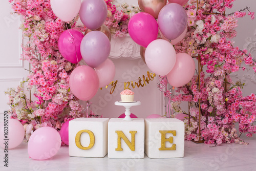 Pink decor with flowers for first birthday