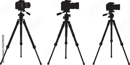 Three identical camera tripods with cameras mounted in a row silhouette