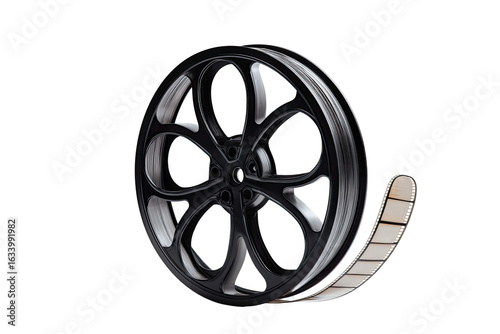 Close-up of a film reel with exposed film strip