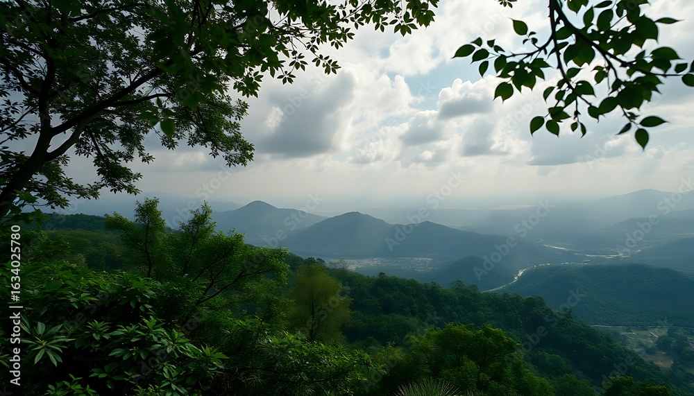 Obraz premium Verdant Mountain Range Under Cloudy Sky