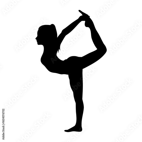 Woman performing yoga dancer pose silhouette