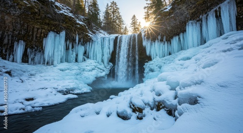 Frozen waterfall cascading through icy cliffs at sunset