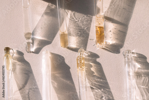Tableau sur toile Close-up of glass pipettes with moisturizing serum with colloidal gold