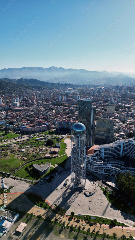 Obraz premium Batumi, Georgia: Aerial View of a Modern City with Port, Skyscrapers, and Breathtaking Nature