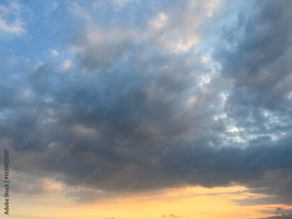 Fototapeta premium Dark, dramatic sky filled with ominous grey storm clouds. Moody and atmospheric natural background