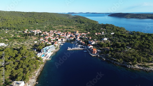 Božava (Bozava) blends serene charm and vivid colors—quaint stone houses, turquoise sea, and sunlit boats create a dreamy Adriatic scene, ideal for captivating, story-rich photography.
