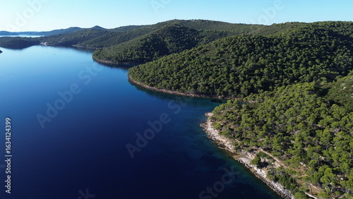 Dugi Otok's rugged stone coast stuns with raw Adriatic beauty—dramatic cliffs, crystal-clear waters, and golden light perfect for breathtaking, timeless photography.
