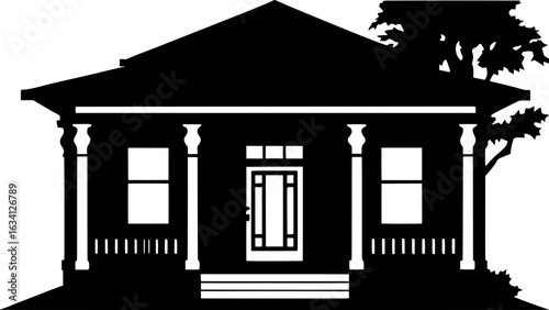 "Serene and balanced composition of a black and white traditional home with detailed porch columns and a central doorway."