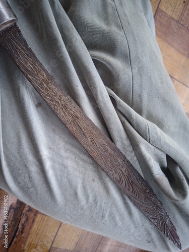 An old, rusty knife blade that is hundreds of years old, this knife is a typical weapon of the Bugis tribe of Sulawesi. 