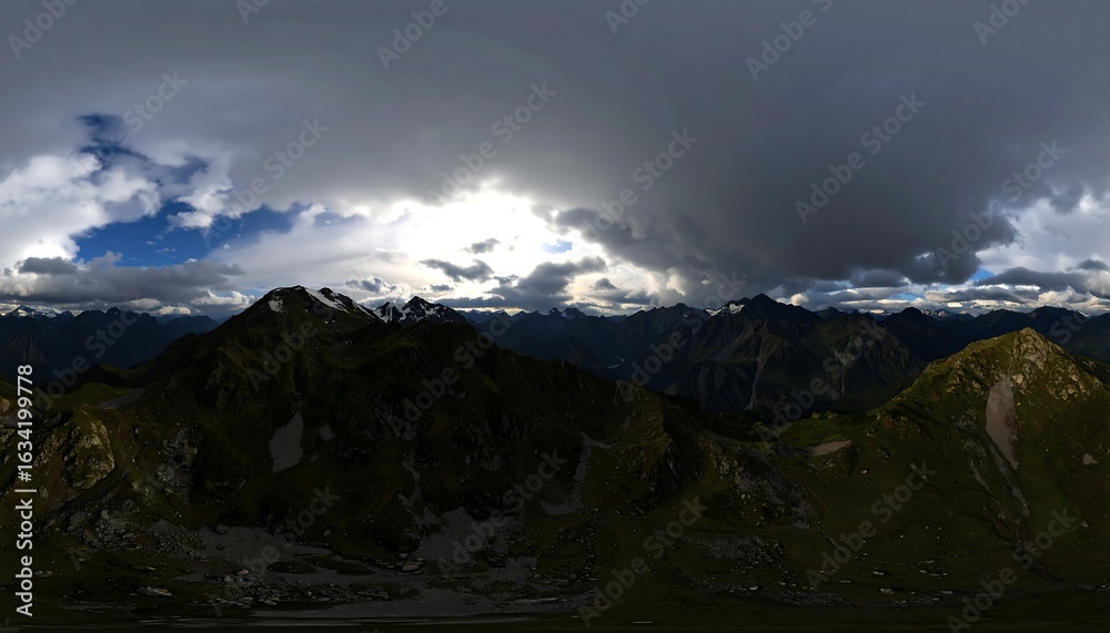 Fototapeta premium Majestic mountain peaks shrouded in dramatic storm clouds panoramic landscape