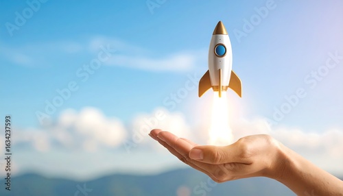 Hand holding a small rocket launching into a light blue sky